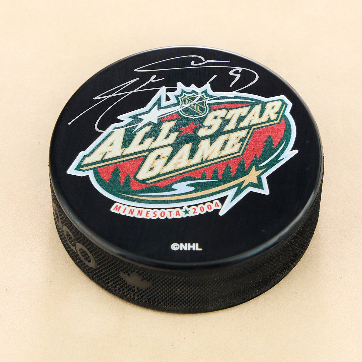 Joe Sakic Autographed 2004 NHL All-Star Game Hockey Puck product image 1, provided for visual reference and product detail