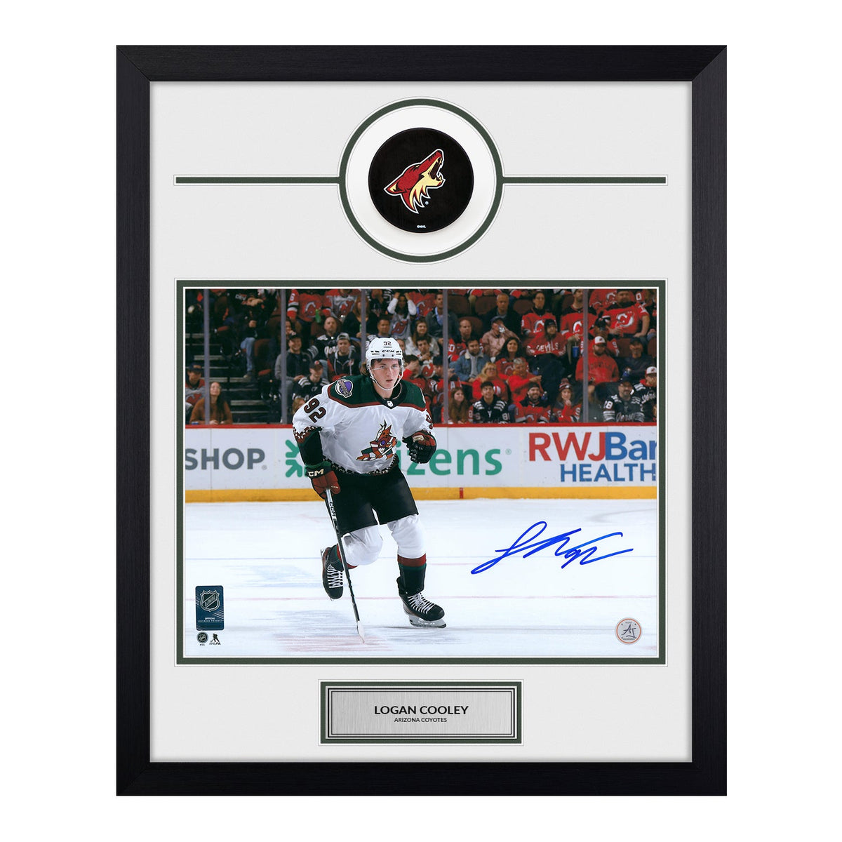 Logan Cooley Autographed Arizona Coyotes Puck Logo 19x23 Frame product image 1, provided for visual reference and product