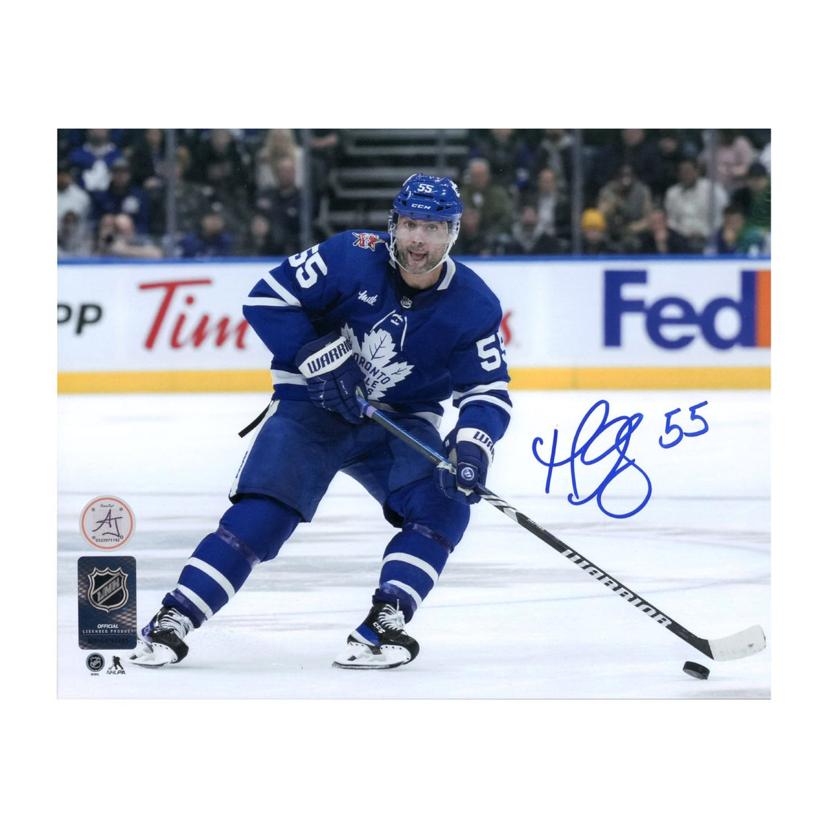 Mark Giordano Autographed Toronto Maple Leafs Puck Rush 8x10 Photo product image 1, provided for visual reference and