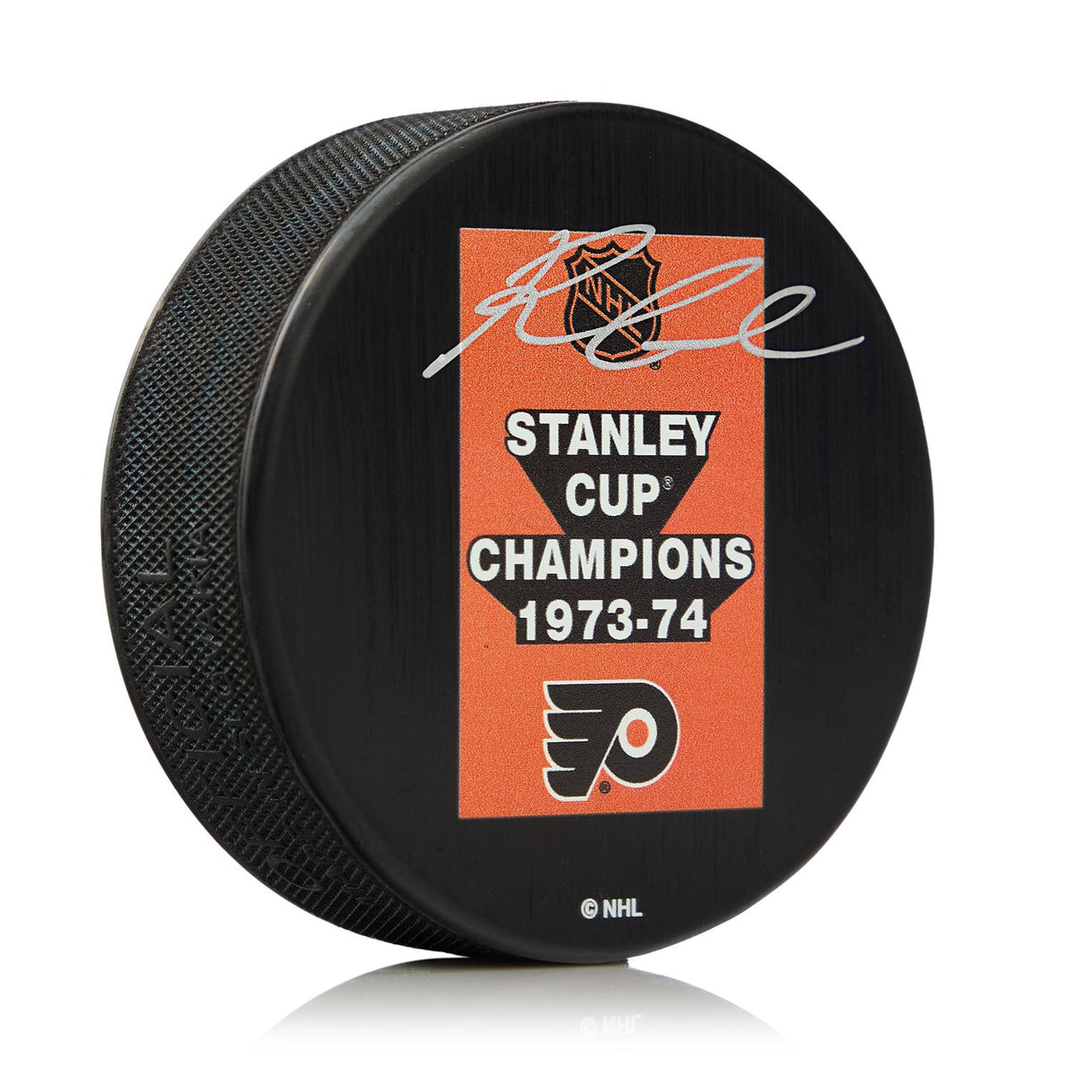 Reggie Leach Autographed Philadelphia Flyers 1974 Stanley Cup Puck product image 1, provided for visual reference and