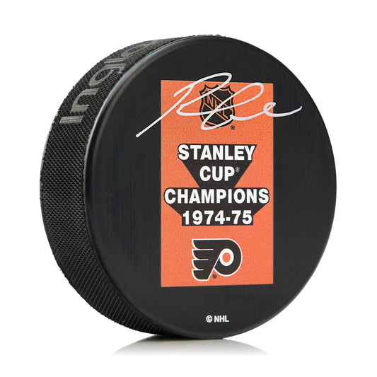 Reggie Leach Signed Philadelphia Flyers 1975 Stanley Cup Puck product image 1, provided for visual reference and product