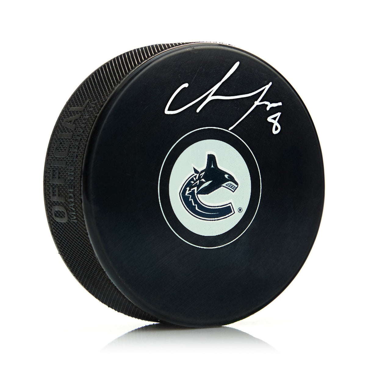 Chris Tanev Autographed Vancouver Canucks Hockey Puck product image 1, provided for visual reference and product detail